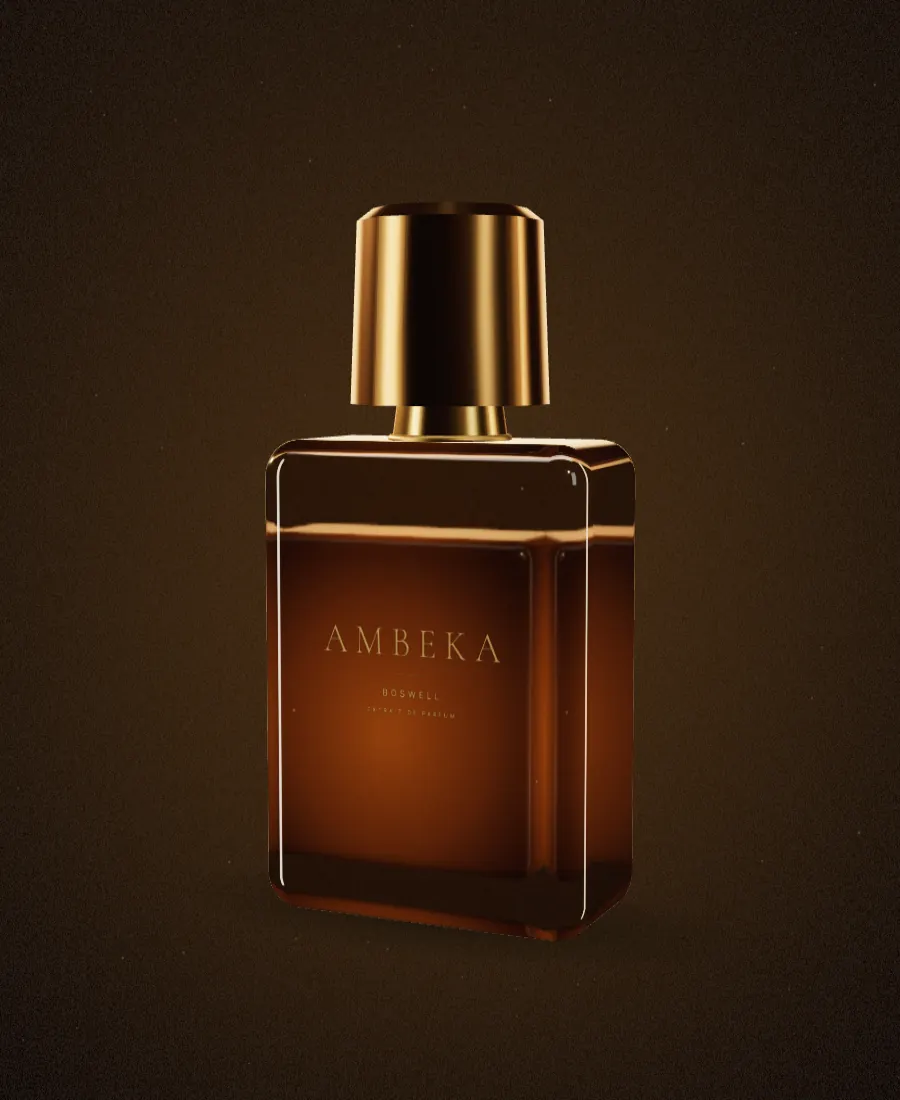 A clear glass Ambeka flacon with an amber extrait and a brass octagonal cap